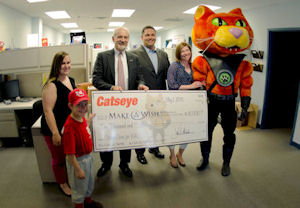 From left are 7-year-old Make-A-Wish Ambassador Kaleb, who went to Disney World in 2012 as his wish; Megan Tatro, Catseye Make-A-Wish coordinator and customer service; William Trigg, CEO of Make-A-Wish Northeast New York; David Miclette, vice president of Catseye Pest Control; Ashlea Keene, Catseye Make-A-Wish coordinator and brand development; and Caddie, the Catseye Pest Control mascot.
