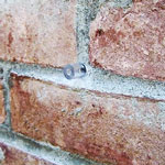 chemical injection port in brick