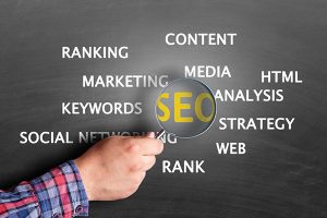 Magnifying glass enlarging SEO photo illustration from iStock.com/triloks