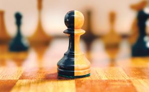 Merged chess piece. ART: ISTOCK.COM/INKOUT/VJOM