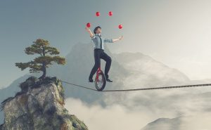 Tightrope juggler illustration from iStock.com/Orla