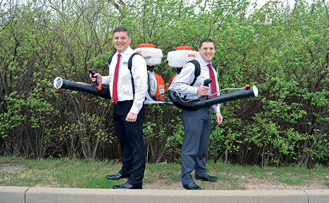 Rest assured, Eric, left, and Kurt Scherzinger only posed without their personal protective equipment (PPE) for the sake of this photo. Photo: Scherzinger Termite & Pest Control
