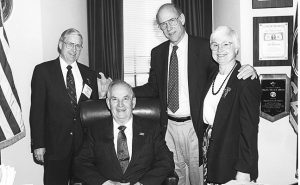 Roland Rhodes, seated, is surrounded by (from left) Hall of Famer Vernon McKinzie (Class of 2013), Sen. Pat Roberts (R-Kan.) and Nancy McKinzie.'Photo: Courtesy of Deborah Ball