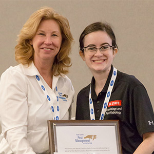 Samantha McPherson receiving her scholarship to North Carolina State University from Marie Horner, NCPMA board member, at the 2019 Pest Control Technician’s School. (PHOTO: NCPMA)