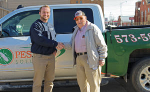 Michael Patterson, left, shakes hands with Dub Hayes to close their business deal. PHOTO: MICHAEL PATTERSON