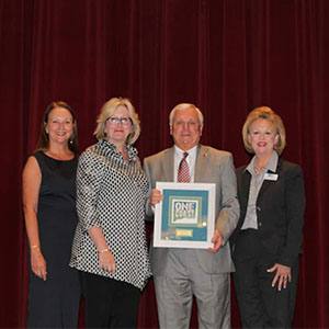 From left, Carla Todd Voda, executive director of Jackson County Chamber of Commerce; Nikki Moon, owner of Bay Town Inn in Bay St. Louis, Mississippi; Gordon Redd Jr., president of Redd Pest Solutions; and Kathy Springer, president of the Mississippi Gulf Coast Chamber of Commerce (PHOTO: REDD PEST SOLUTIONS)