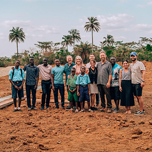 COTN founders Chris and Debbie Clark (middle) and the Aust family (middle, right) with COTN students. PHOTO: THE AUST GROUP