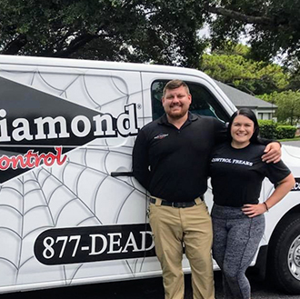 Franchise owners Nick Vonella and Ashley Naumann stand in front of their new company vehicle at Black Diamond Pest Control in Pinellas County, Fla. PHOTO: BLACK DIAMOND PEST CONTROL