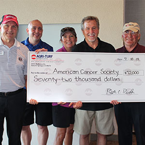 From left are Rich Records of Agri-Turf Distributing, Aaron Rhoderick of Tri-West Ltd., Kristen Thompson of the American Cancer Society, Allen Gage of Tri-West Ltd., and Lon Records of Agri-Turf Distributing. PHOTO: AGRI-TURF DISTRIBUTORS