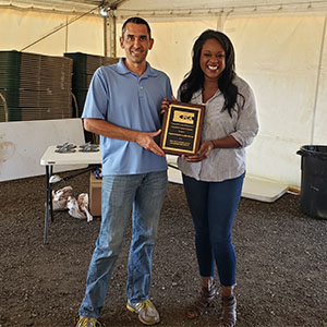 CPCA Director Kevin Lemasters (left) and Rep. Leslie Herod display Rep. Herod's Legislative Champion award. PHOTO: CPCA