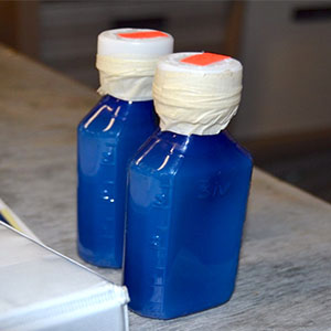 These two unlabeled bottles led law enforcement in both Carolinas to pursue an illegal pesticide case that claimed the lives of a pair of pets. PHOTO: CLEMSON UNIVERSITY PUBLIC SERVICE AND AGRICULTURE