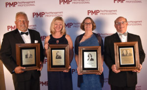 Dave Mueller, Dr. Dini Miller, Judy Black and Lonnie Alonso received plaques at the PMP Hall of Fame induction ceremony on Oct. 14, 2019. (PHOTO: DANIELLE PESTA)