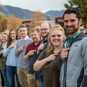 Fox Pest team members display their pink ribbons at the Utah home office. PHOTO: FOX PEST CONTROL