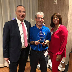 From left are Victor Aimi, the immediate past president for PRSA Greater Fort Lauderdale; Toby Srebnik; and Jennifer Hudson, the incoming chapter president. PHOTO: TRULY NOLEN