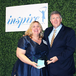 Kelly Solomon receiving the award on behalf of Rollins for Volunteer of the Year in 2019. PHOTO: ROLLINS