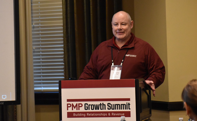 PMP Editorial Director and Published Marty Whitford addresses attendees before partners give their boardroom presentations. PHOTO: PMP STAFF