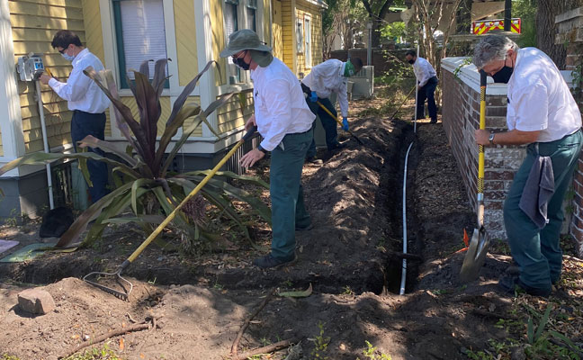 Members of Massey's landscaping team work at the onePULSE Foundation headquarters. PHOTO: MASSEY SERVICES
