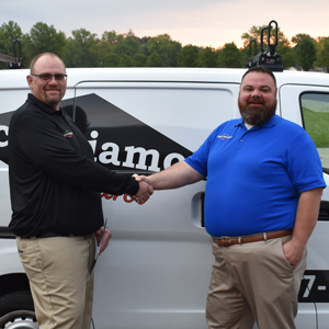 Director of Business Expansion Travis Donaldson (right) congratulates Branch Operations Manager Brian Thornton (left) on opening Black Diamond's newest branch location in Knoxville. PHOTO: BLACK DIAMOND PEST CONTROL