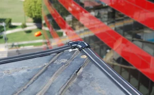Installation of Bird Shock electronic track on building roof