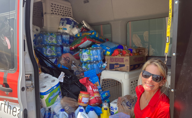 Stephanie Jones, administrative assistant of the Orkin Jonesboro, Ark. branch, sits in a Northeast Arkansas Humane Society van after a successful event. (Photo courtesy of Stephanie Jones)