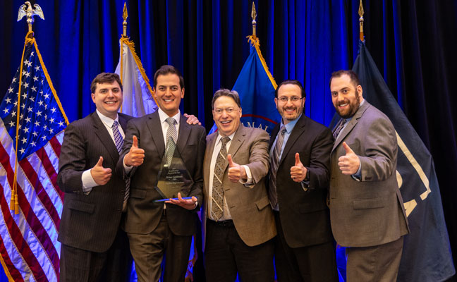 SBA award winner Brian Goldman celebrates with his family. From left are Kevin, Brian, Stephan, Scott and James Goldman. PHOTO: BIG BLUE BUG SOLUTIONS