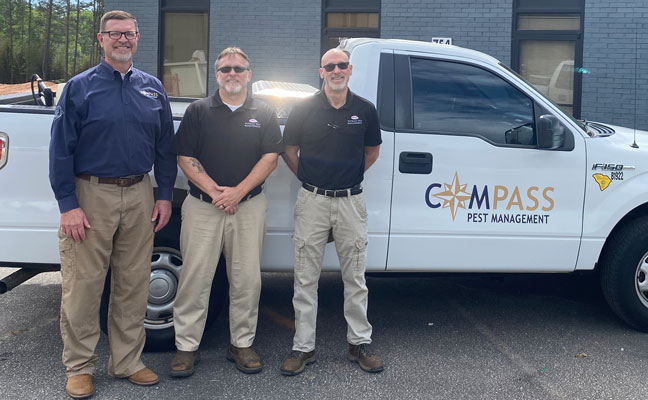 From left are Compass President and CEO Philip Smith alongside Richard Windsor and Marty Putman. IMAGE: COMPASS PEST MANAGEMENT
