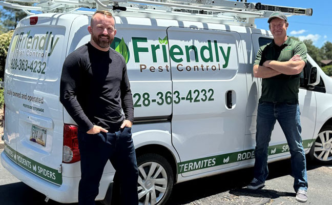 Brent Agee, left, finalized a deal with Matt Abney, to bring Friendly Pest Control employees onto the ACTION Termite and Pest Control team. IMAGE: ACTION TERMITE & PEST CONTROL