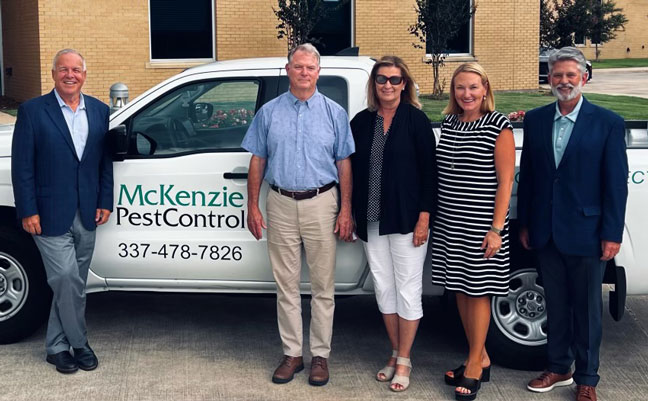 Pictured from left are Arrow's Kevin Burns, former McKenzie Pest Control co-owners Keith and Kim Dubrock, and Arrow's Emily Thomas Kendrick and Tim Pollard. IMAGE: ARROW EXTERMINATORS