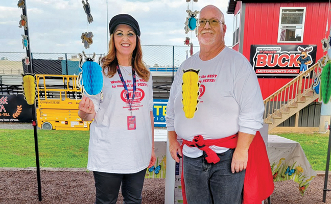 At their first event in May 2023, Dominion Pest Control co-owner Maria Pettis and new product analyst Jason Rothamel chatted with eventgoers as they passed the company’s tent on the way to their seats