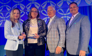 Karen Larson, (second from left) Clarke, was recognized for her term as Chair of the RISE Governing Board 2022-2024. Honoring her is the Executive Committee from left President Megan Provost, Treasurer John Johnson, and Vice Chair Todd Mason. PHOTO COURTESY OF RISE