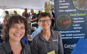 ConidioTec’s Carrie Sprout, left, and Dr. Nina Jenkins are a common sight at industry events, such as this New Jersey Pest Management Association meeting in 2019. PHOTO: APREHEND