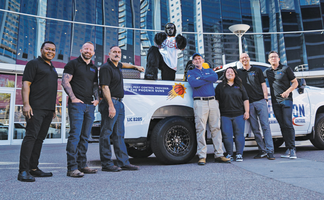 Brent Agee, second from left, and his leadership team celebrate the July announcement that ACTION Termite & Pest Control is the official pest control provider of the Phoenix Suns. The NBA team’s mascot, The Suns Gorilla, was also on hand for the announcement. PHOTO: BRENT AGEE