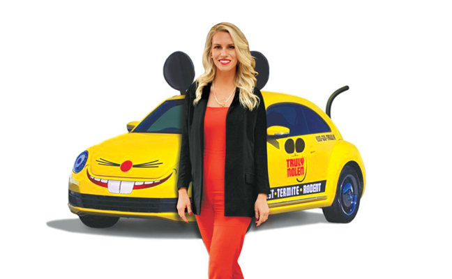 Scarlett Nolen and one of her company’s “Mouse Cars” that promotes pest control in a fun way. PHOTO: THE PEST POSSE