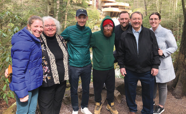 Hottel, second from left, with her family at Fallingwater in Mill Run, Pa.: daughter-in-law Laura; sons Ben, Robby and Justin; husband Andy; and daughter-in-law Kayleigh. PHOTO COURTESY OF PATRICIA HOTTEL