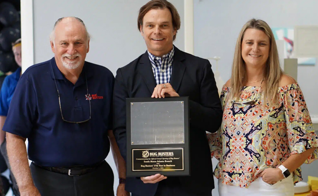 From left: Neil Parker, Court Parker and Daphne Bertholf, after winning a local award. PHOTO: BUG BUSTERS