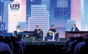 The kickoff presentation hosted by Jon Gohl, Aspire’s director of customer experience (at desk), had a late-night talk show vibe. Pictured from left are “interview guests” Mark Tipton, CEO of Aspire; Shandra Brannon, Chief COO of Heritage Landcare, Gilbert, S.C.; and Scott Broaddus, VP of expansion with Ogden, Utah-based Hawx Pest Control. PHOTO: SERVICETITAN