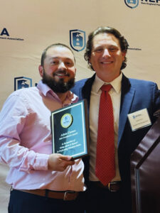 Outgoing NEPMA President David Flynn honored Adam Carace, ACE, of Pest-End with the President’s Award. PHOTO: NEPMA