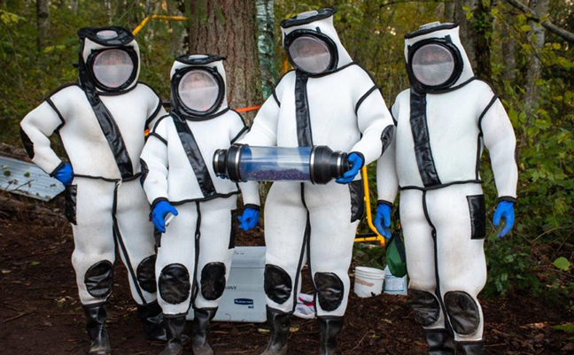 WSDA's hornet eradication team after removing hornets from the tree at the first hornet nest detection in the United States, Oct. 2020. From left, Chris Looney, Cassie Cichorz, Sven Spichiger and Rian Wojahn. (Photo courtesy of Washington State Department of Agriculture)