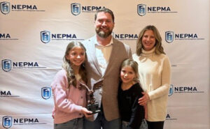 Galvin Murphy Jr. poses with his family during the ceremony where he was honored with the Bartlett W. Eldridge award. PHOTO: NEPMA