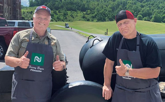 PITMASTER PROS Harry Bryan left, and John Singletary, ACE, create feasts and fun on behalf of Nisus at industry events. (PHOTO: NISUS)