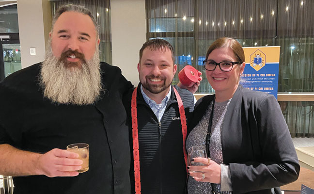 Trio of talent: As is Raise the Bar tradition, James Miller, ACE, director of PCO global sales for Trécé Inc. and president-elect of Pi Chi Omega, offered his armspan to measure “an arm’s length” of raffle tickets for sale. Pictured with Miller are Liphatech’s Nick Fugate and third-generation pest management professional (PMP) Molly Marsh, Patton Pest Control, Novelty, Ohio. PHOTO: PI CHI OMEGA