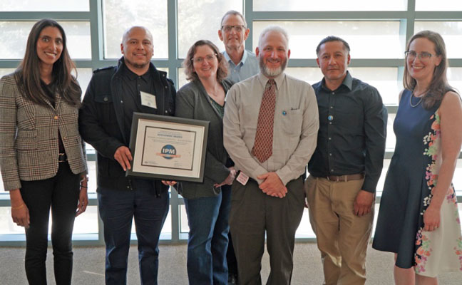 From left: Sapna Thottahil, deputy director of sustainable pest management, Department of Pesticide Regulation; Jose Gallegos-Jeronimo, grounds IPM technician, UCSC; Julie Sutton, associate director grounds & custodial services, UCSC; Bill Reid, grounds coordinator - campus site stewardship program, UCSC; Joshua Goldman, superintendent for grounds specialty crew, UCSC; Rudy Balderas, grounds IPM technician, UCSC; and Karen Morrison, Director, Department of Pesticide Regulation. PHOTO COURTESY OF UC SANTA CRUZ