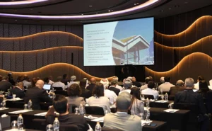 A packed audience listening to one of the educational presentations . PHOTO COURTESY OF NPMA