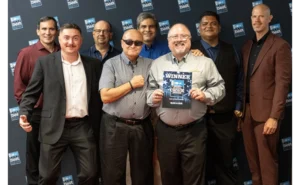 Group photo of the Slug-A-Bug leadership team with their award.