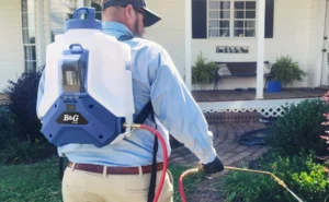Technician demonstrating B&G backpack sprayer