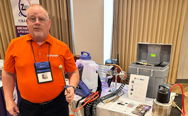 Craig Martelle of Pelsis showing off the company booth and product. IMAGE: PMP STAFF