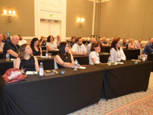 Attendees listen to partner presentations to kick off the 2026 Summit.