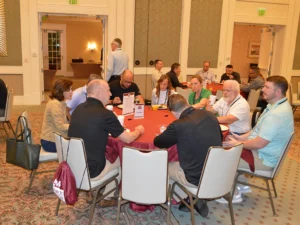 Attendees discuss employee hiring, retention and acknowledgement strategies with Digital Media Specialist RJ Simon. IMAGE: PMP STAFF